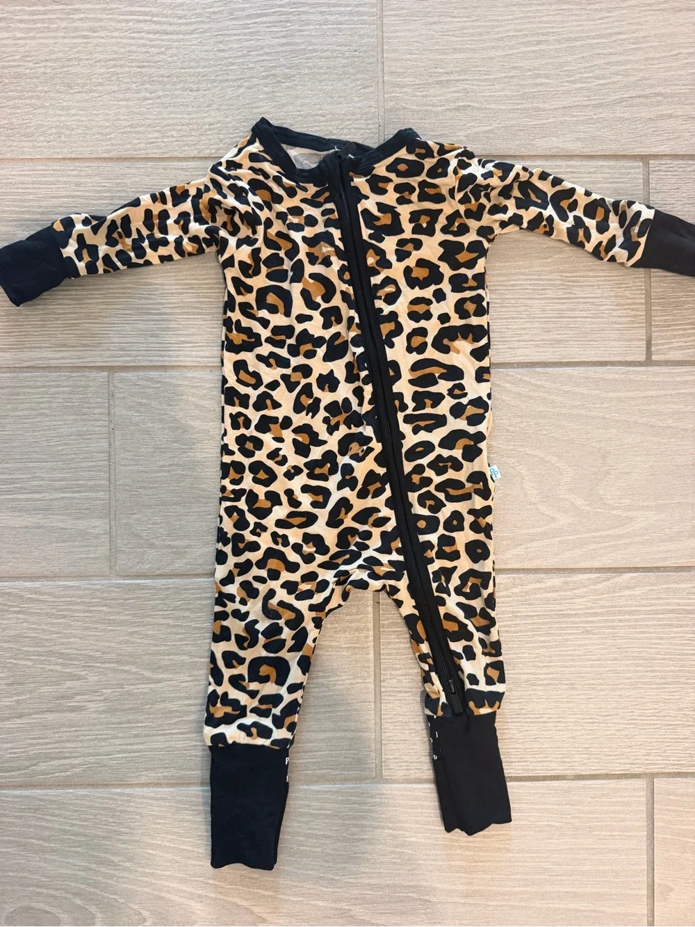 Posh Peanut Leopard Print One-Piece Footie with Black Trim